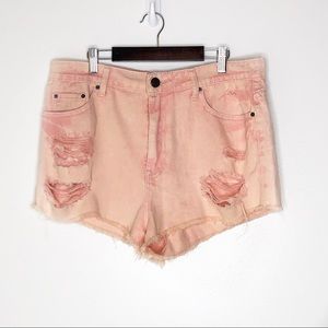 NWT. BDG Peach colored high rise distressed shorts
